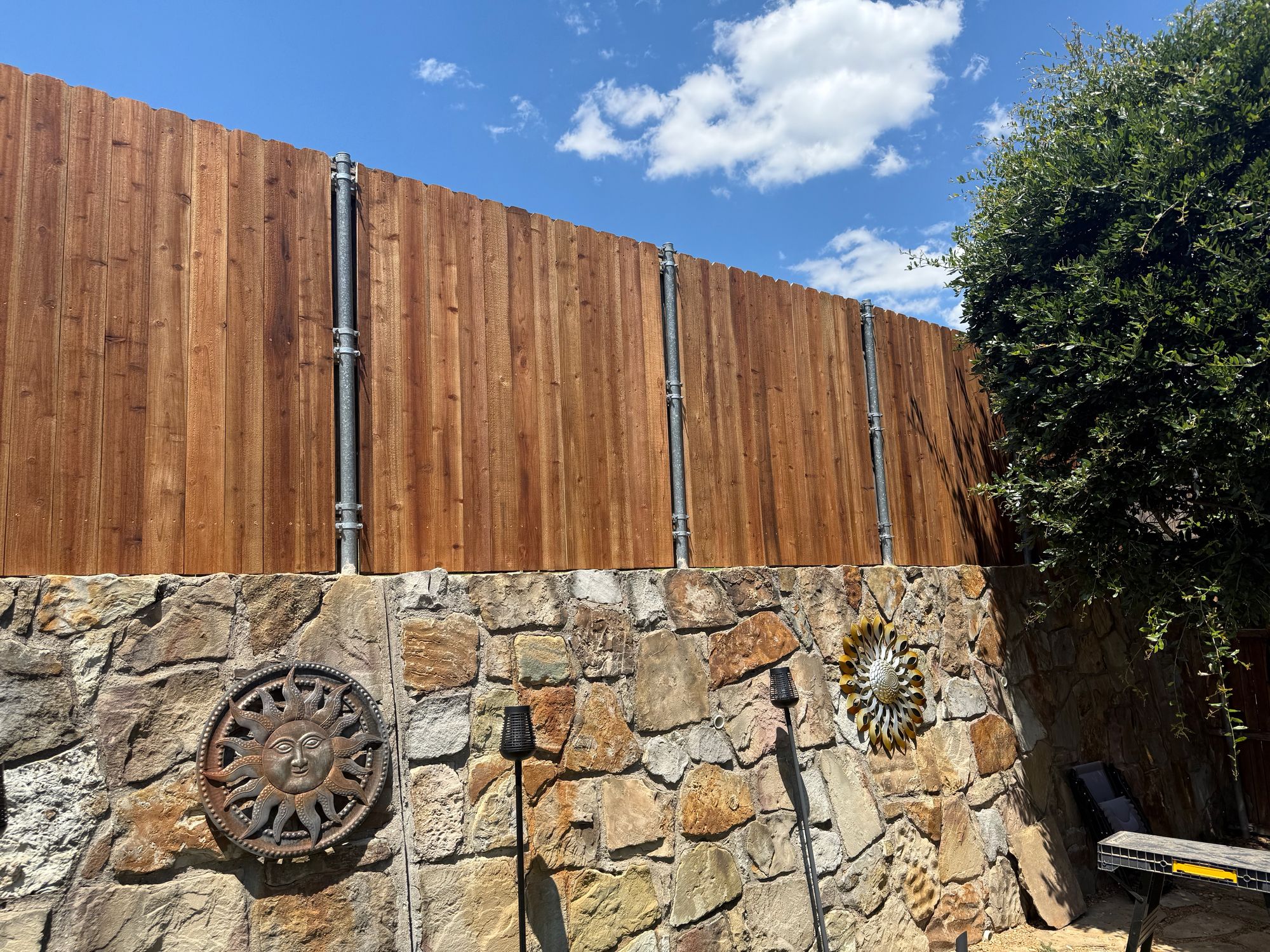 Wood fence installation in progress