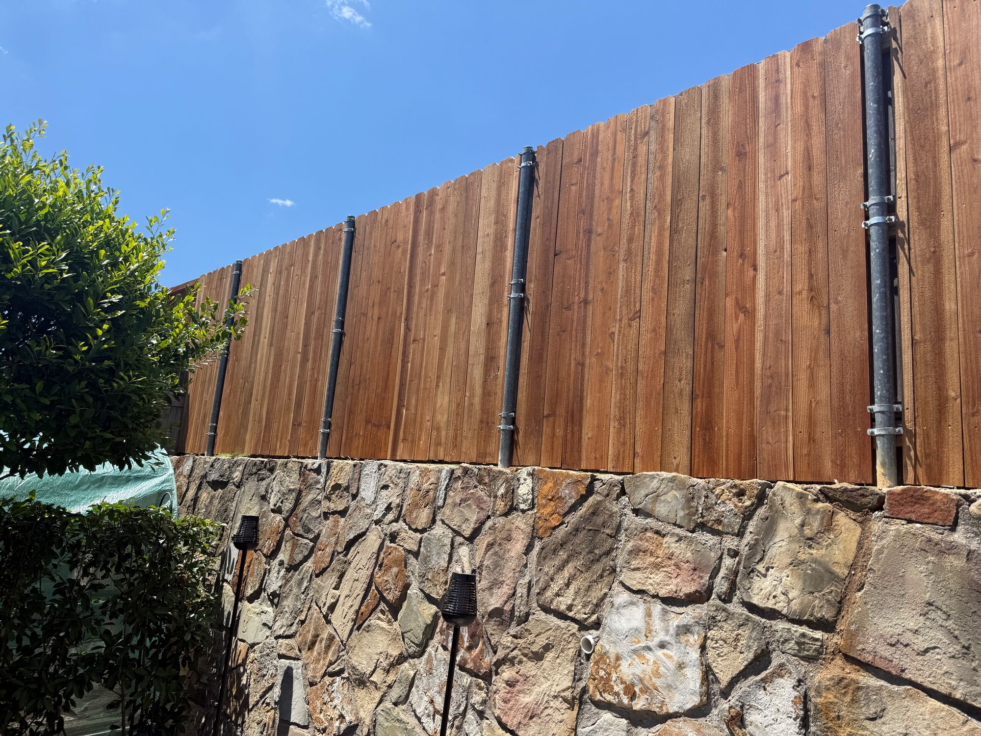 Completed wood privacy fence in North Texas